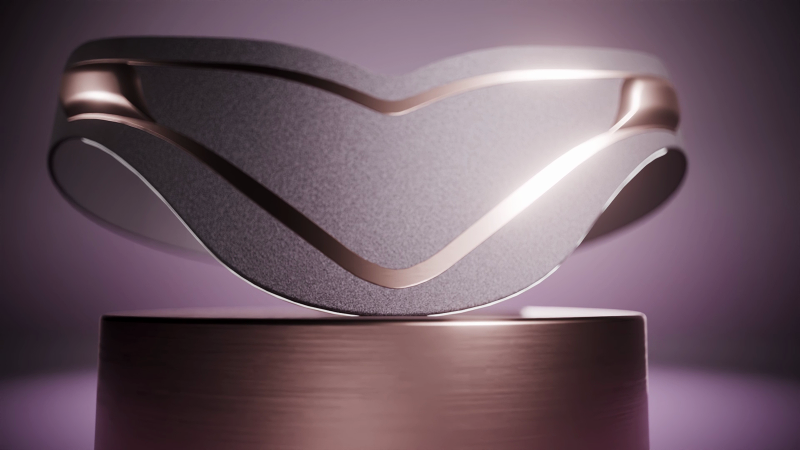 Low front three quarter view of the MinaRosa belt, showing the rose gold piping flowing along the soft textile shell